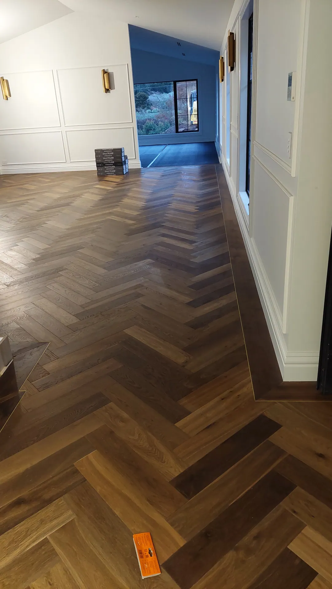 Herringbone oak with a border down a hallway.