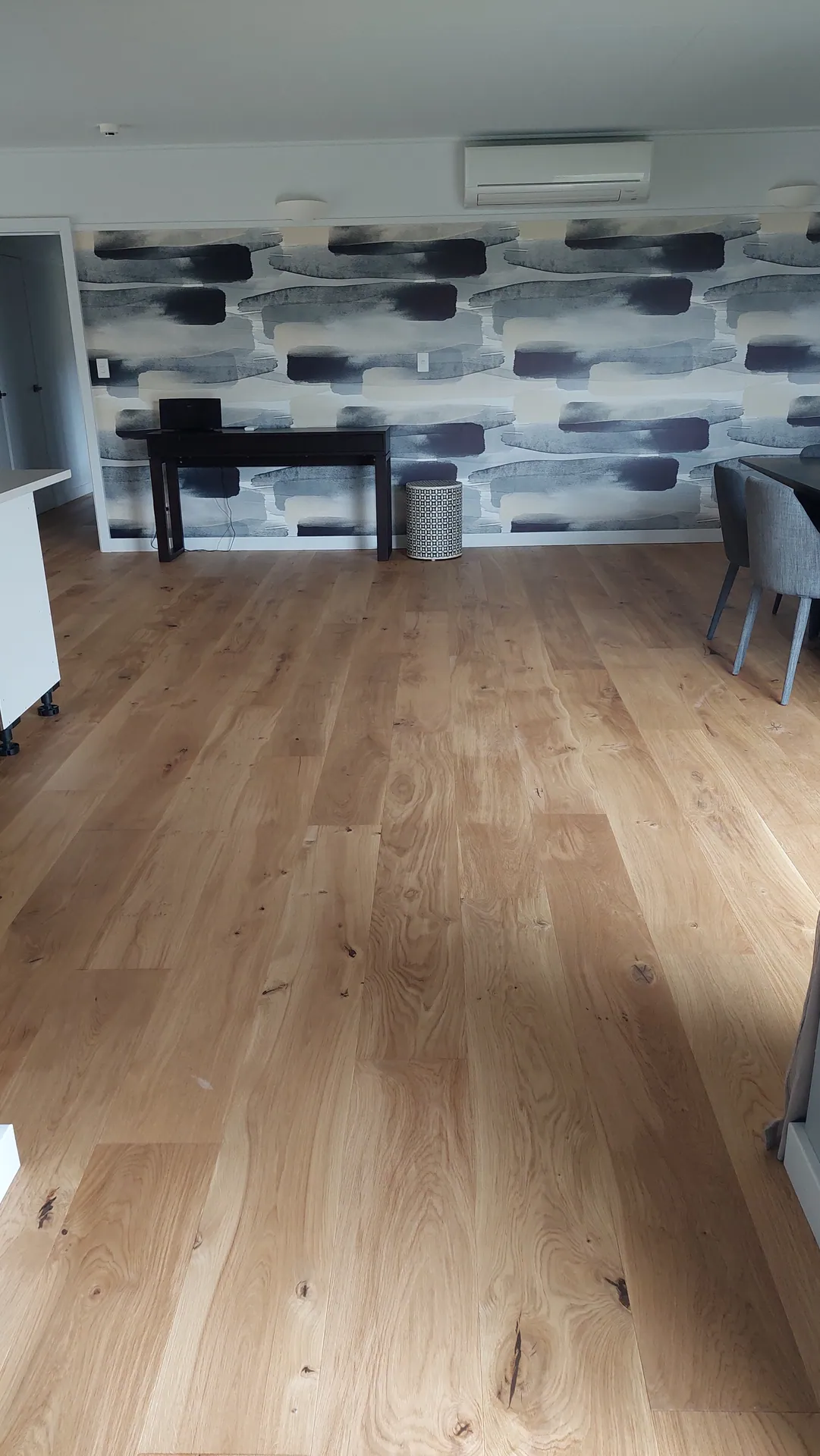 Light oak floor in a dining area.