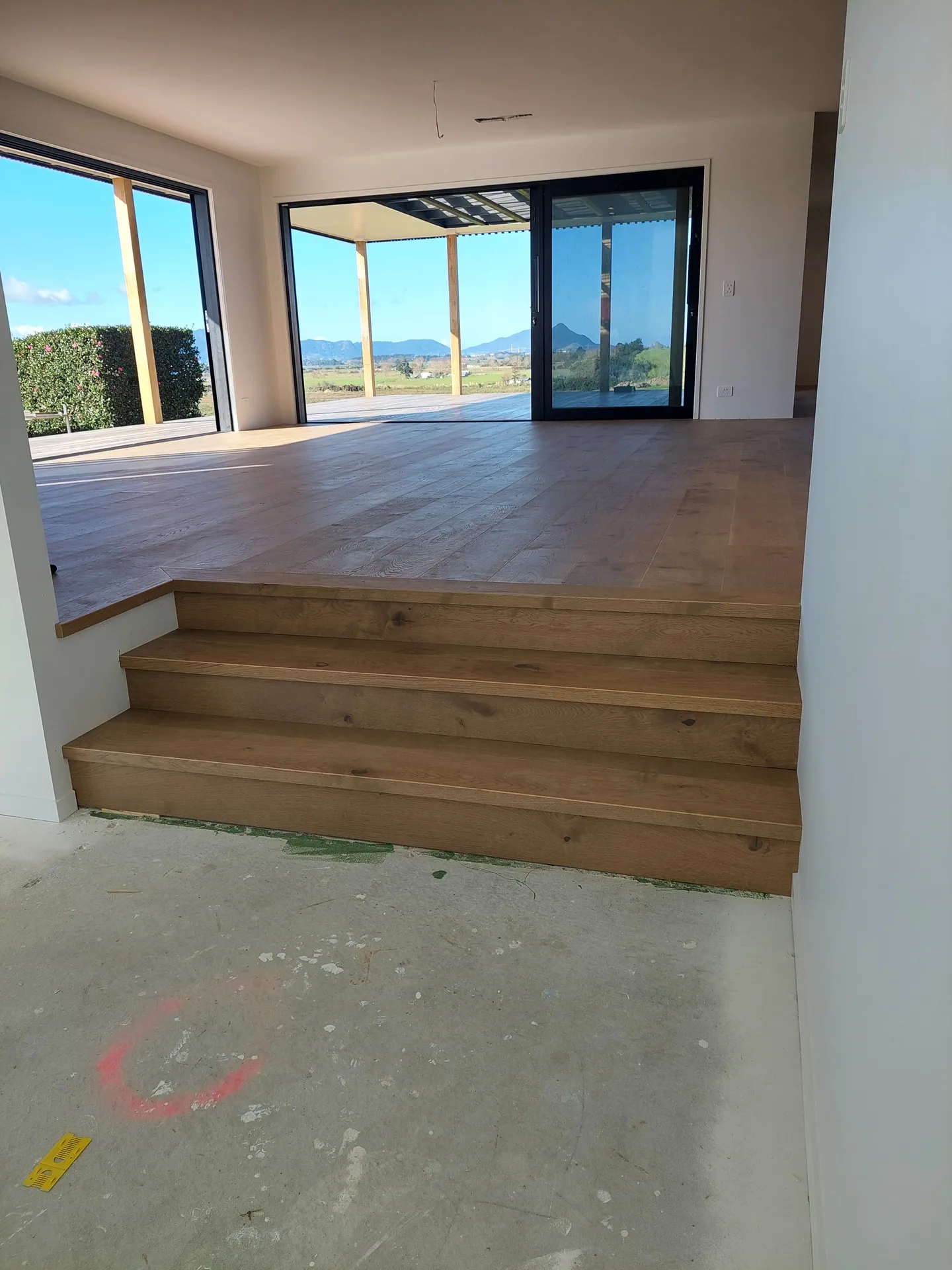 Oak steps up to a raised living area.